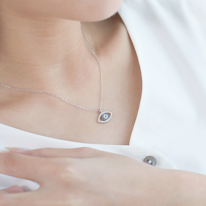 Silver evil eye pendant necklace with blue zircon
