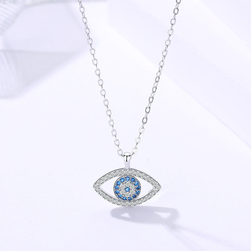 Silver evil eye pendant necklace with blue zircon