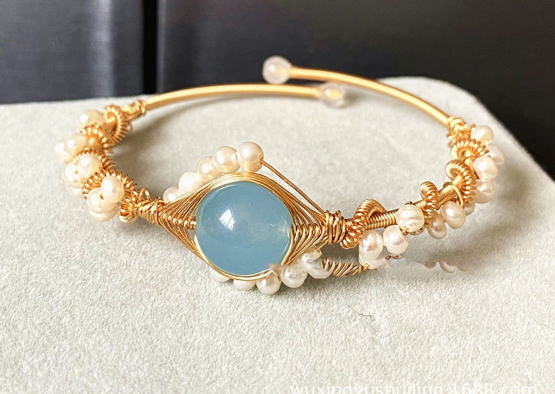 Gold braided wire cuff bracelet with pearls