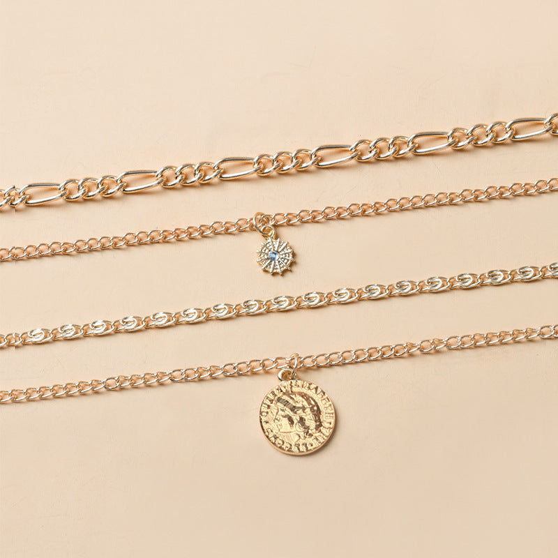 Gold layered coin charm necklace