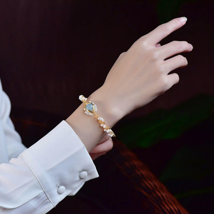 Gold braided wire cuff bracelet with pearls
