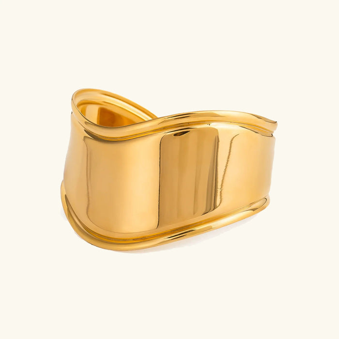 Sculptural Gold Cuff Bracelet with Fluid Wave Design