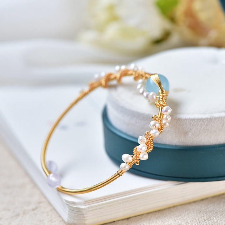 Gold braided wire cuff bracelet with pearls